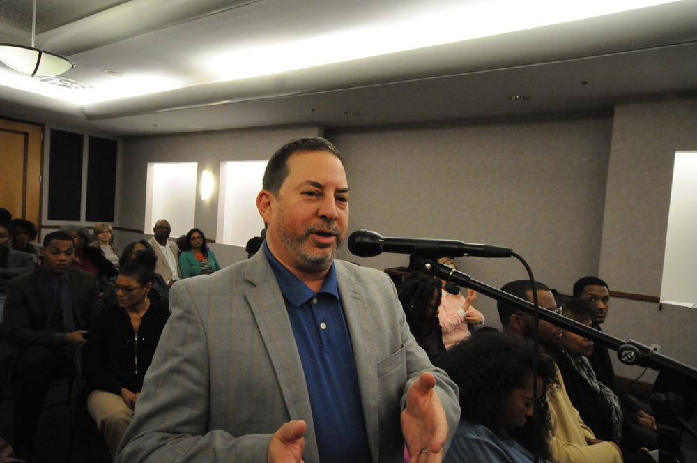 Audience member Mitch Leff asks the panel a question.
