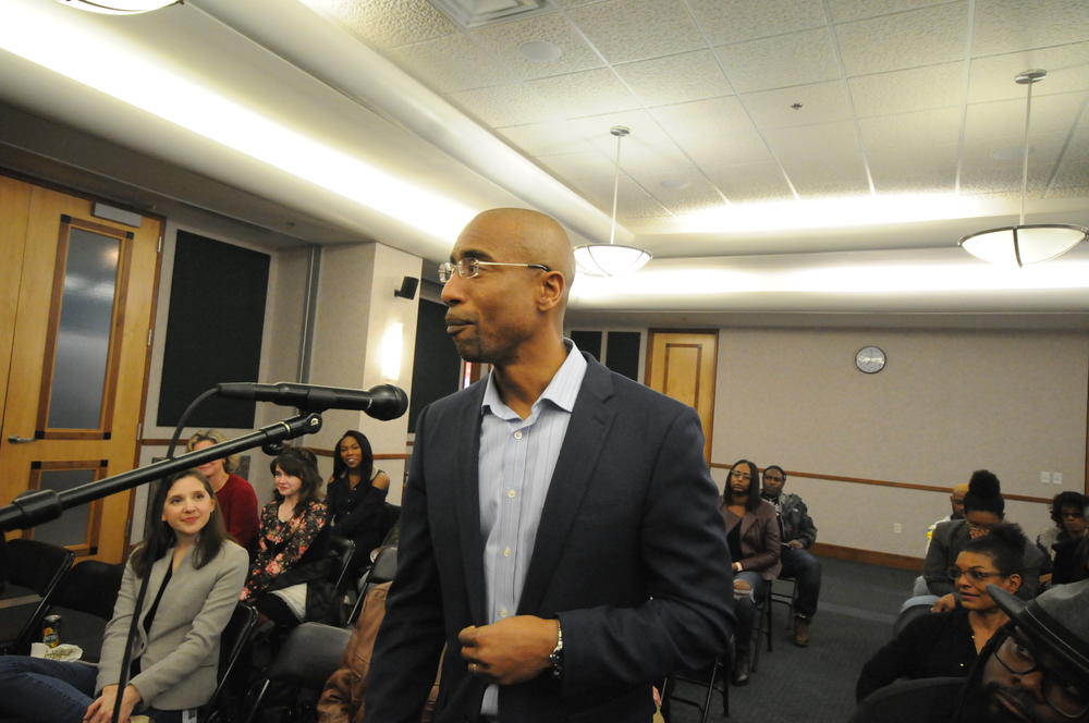 Audience member Sholon Rucker asks the panel a question.