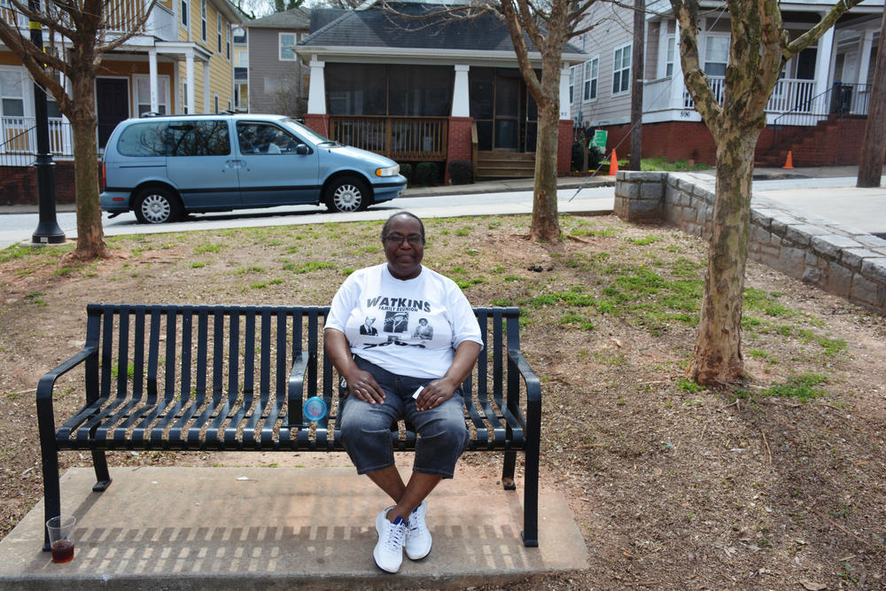 Mary Beckham sits and watches children play in Vine City Park.