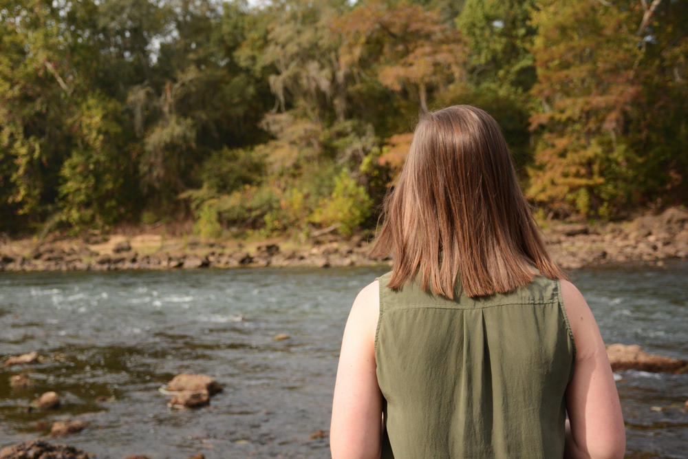 Casey Cox looking out over the Flint River and the water that's the key to her future as a farmer.