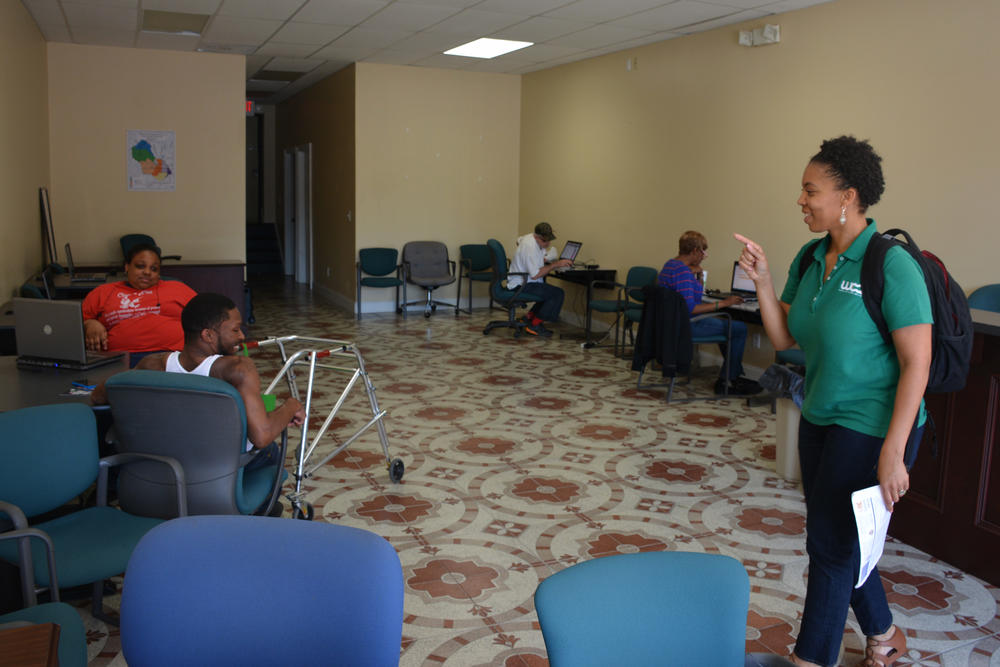 Sheri Davis-Faulkner jokes with Jaferrell Jenkins, one of the lab's regulars.