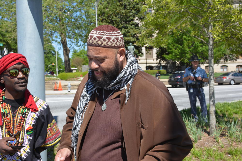 Jihad Abdul Muhammad shares his concerns about the rally with reporters.