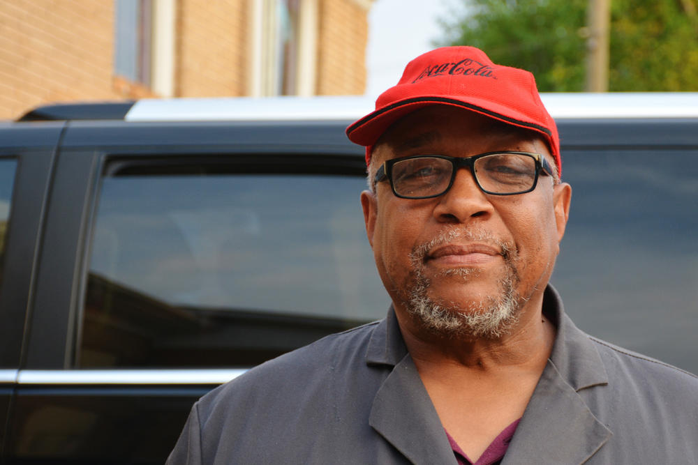 Robin Carmichael, Sr. stops on the way out of a meeting of the Vine City Civic Association.