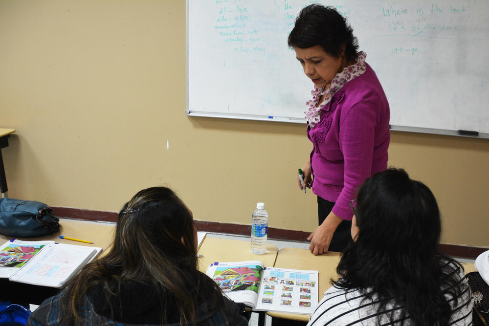 America Gruner leading her students through an English exercise. Gruner said attendance for the free lessons has dropped off since President Trump's executive orders on immigration.