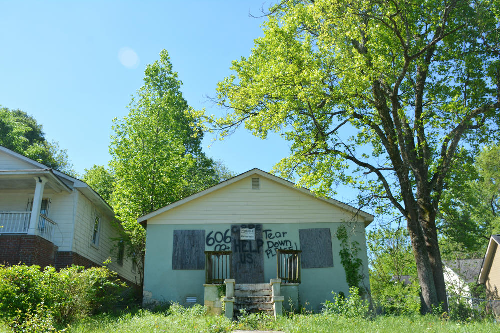 One of the area's many boarded-up homes, more than 40 percent of which are vacant.