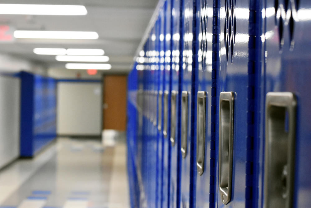 Bright blue lockers line the hallways of Cristo Rey Atlanta, which once was the home of apparel company Oxford Industries. The developer donated the multi-million dollar building to the school. 