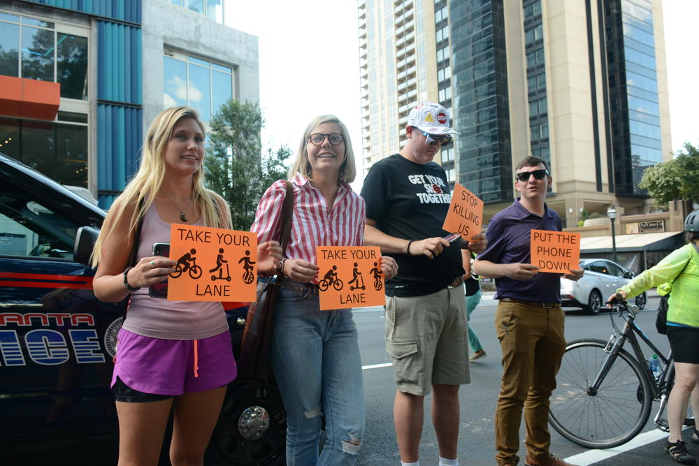 Residents formed a human protected bike lane in late July after a pedestrian was hit and killed on an e-scooter in downtown Atlanta.