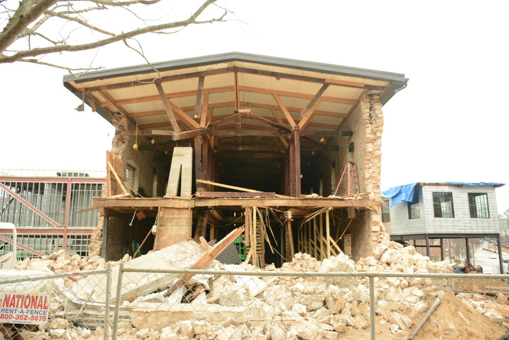 The historic site that most recently housed the Masquerade music venue partially collapsed Friday. 