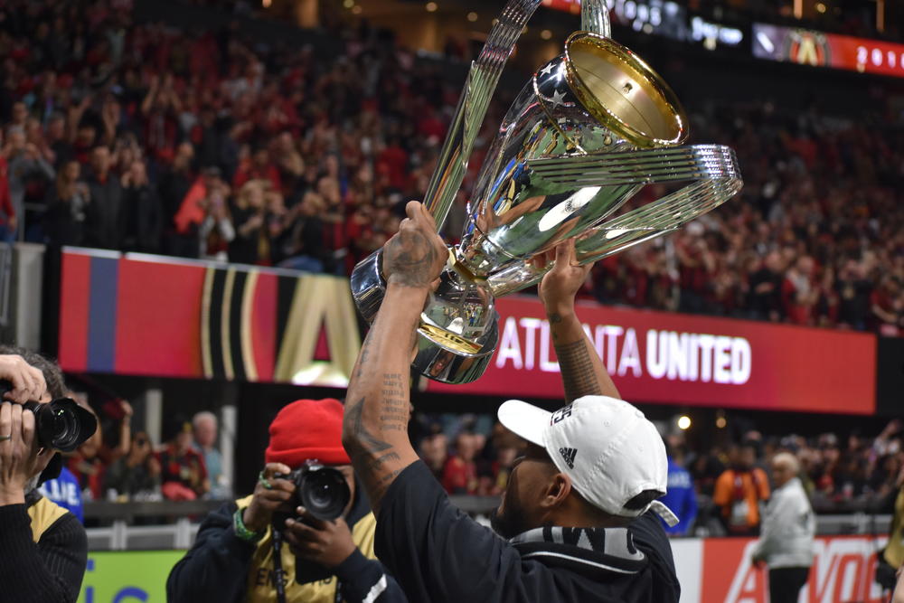 Josef Martinez hoists the MLS Cup