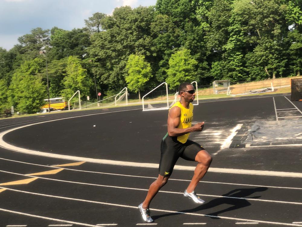 Sprinter Durran Dunn warming up on track field in Smyrna.