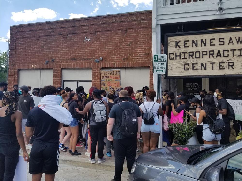 Protestors rallied outside of Wildman's Shop in Kennesaw. The controversial store has a lengthy history of selling racist paraphernalia.