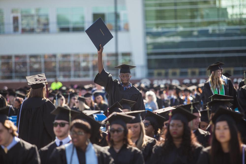 Students at Georgia Southern University attend the 2016 graduation ceremony. The school is merging with Armstrong State University, but will keep its name.