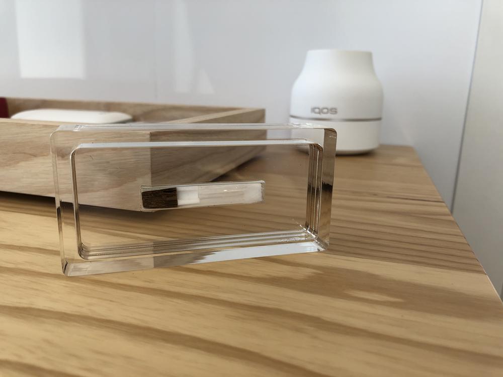 The IQOS heat stick contains processed and rolled tobacco that is inserted into an electric device and inhaled. The tobacco is heated to 570 degrees and inhaled as an aerosol.