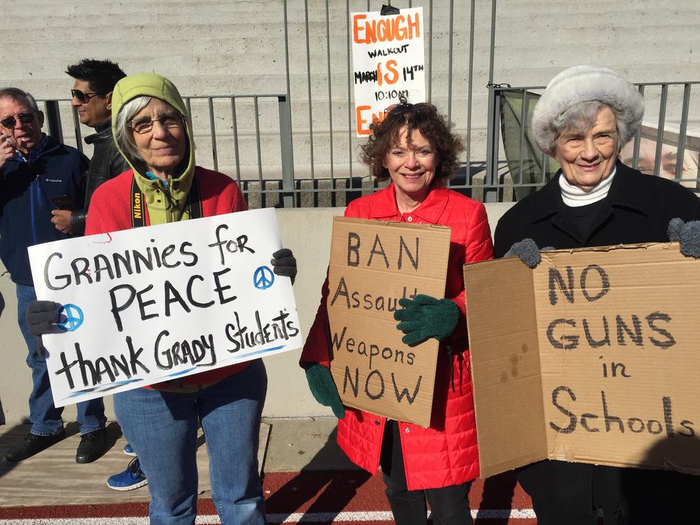 Women from the advocacy group Grannies for Peace support Grady students from the sidelines during their walkout.