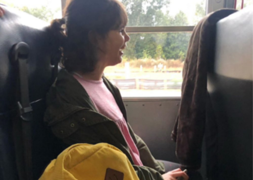 Sadie Boggs on a school bus, one of her favorite parts of the school day.