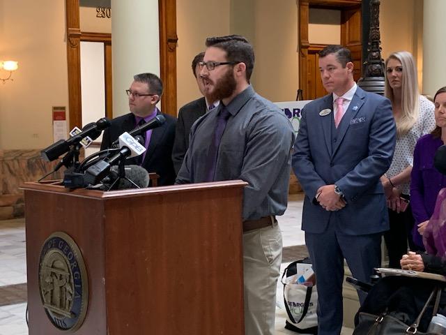 Kyle White speaks at a press conference at the Capitol about how cannabis oil helps him with PTSD.