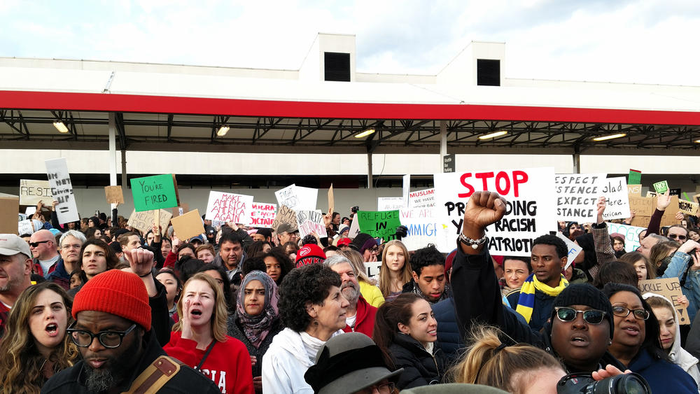 Demonstrators gather at Hartsfield-Jackson Atlanta International Airport on January 29 to protest President Trump's executive action on refguees and immigration.
