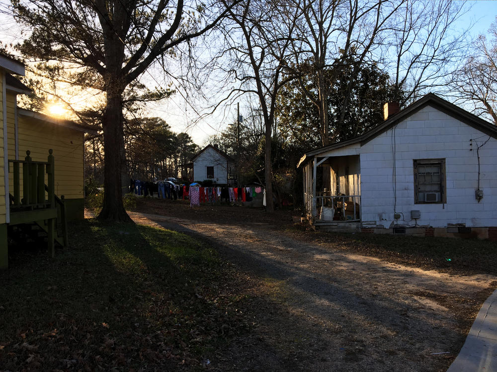 The sun sets on the Rose Hill neighborhood of Porterdale, Georgia. These homes were built in the early 20th century for African-American workers at the nearby cotton mill.
