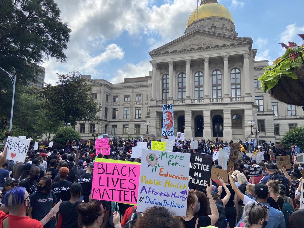 Protesters gather outside of Georgia Capitol following recent cases of police brutality and voting issues.