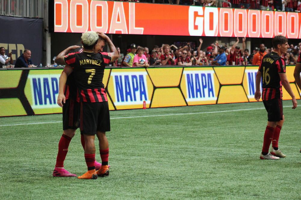 Atlanta United forward Josef Martinez celebrates a goal by midfielder Julian Gressel in the second half of an MLS match against New England, Sunday, Oct. 6, 2019, in Atlanta.