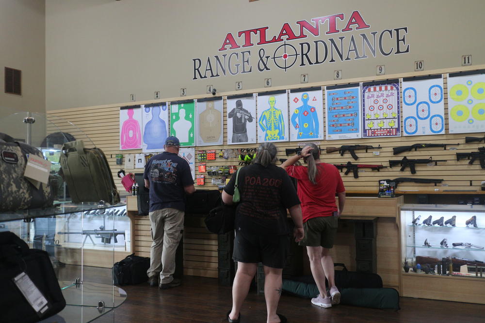 Lines form at the check-out counter at Atlanta Range and Ordnance in Newnan, Georgia as customers purchase guns and ammunition. 