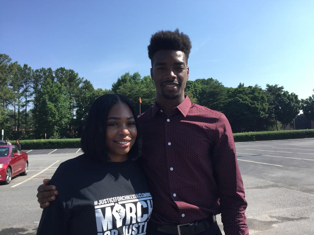 Chikesia Clemons (left) and Anthony Wall before a march for justice Friday June 15, 2018, in Norcross. They are part of a group protesting Waffle House after its employees called police on them in two different instances.