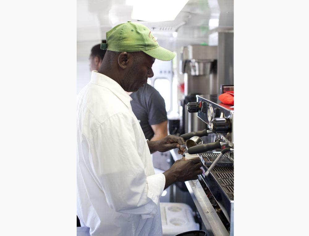 Leon Shombana prepares espresso for Refuge Coffee's customers.