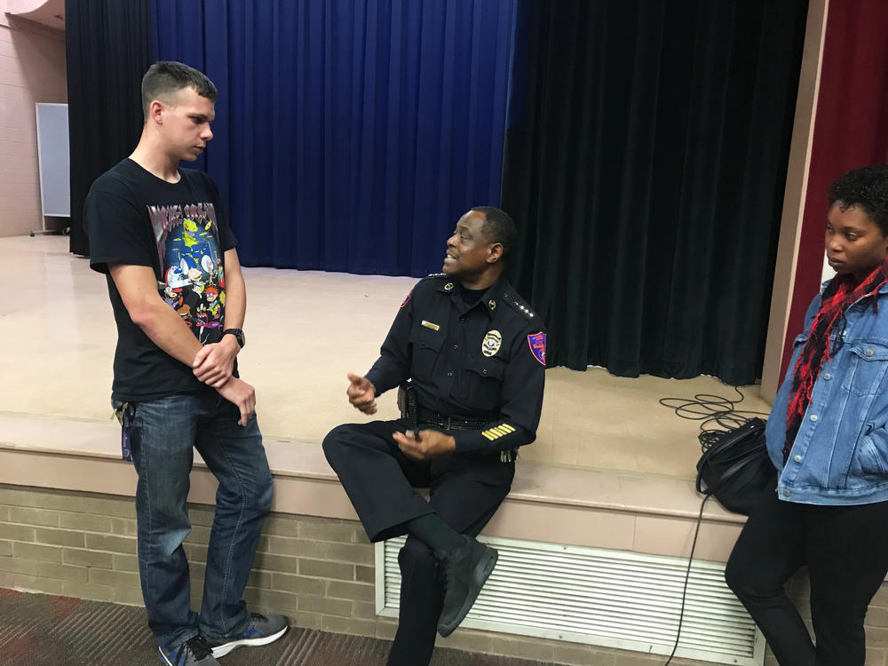 Chief James Barnwell talks to students after an educational meeting about active shooters. He says community policing is the top priority for campus police.