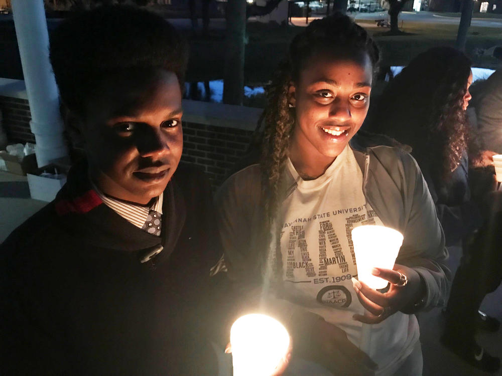 Savannah State students Schonn Franklin and Haley Swindle at a candlelight vigil to memorialize victims of gun violence on campus. 