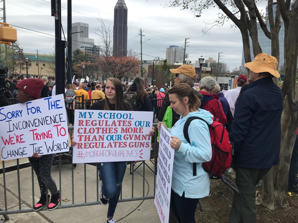 Protesters listen to a speech by a Parkland survivor. 