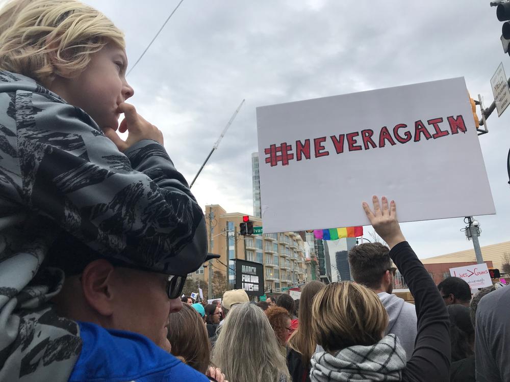 One marcher gets a better view on his dad's shoulders. Parents were instructed to find the rainbow flags in case they were seperated from children at the march. 