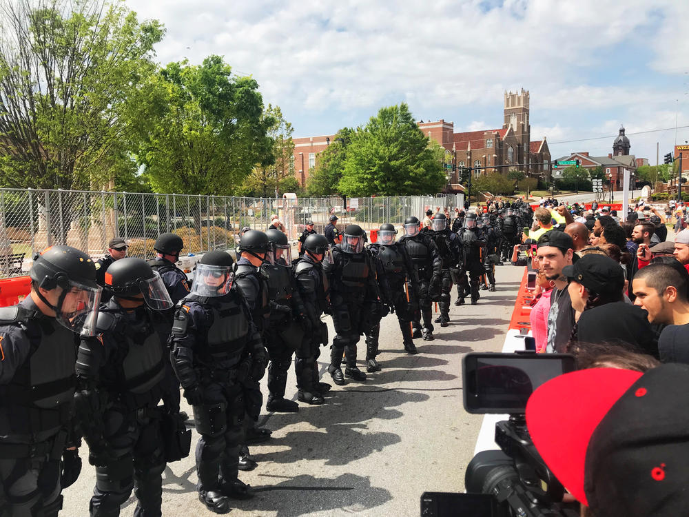 Georgia State Patrol in riot gear kept protestors 75 yards away from a National Socialist Movement rally in Newnan's Greenville Park on April 21, 2018. 