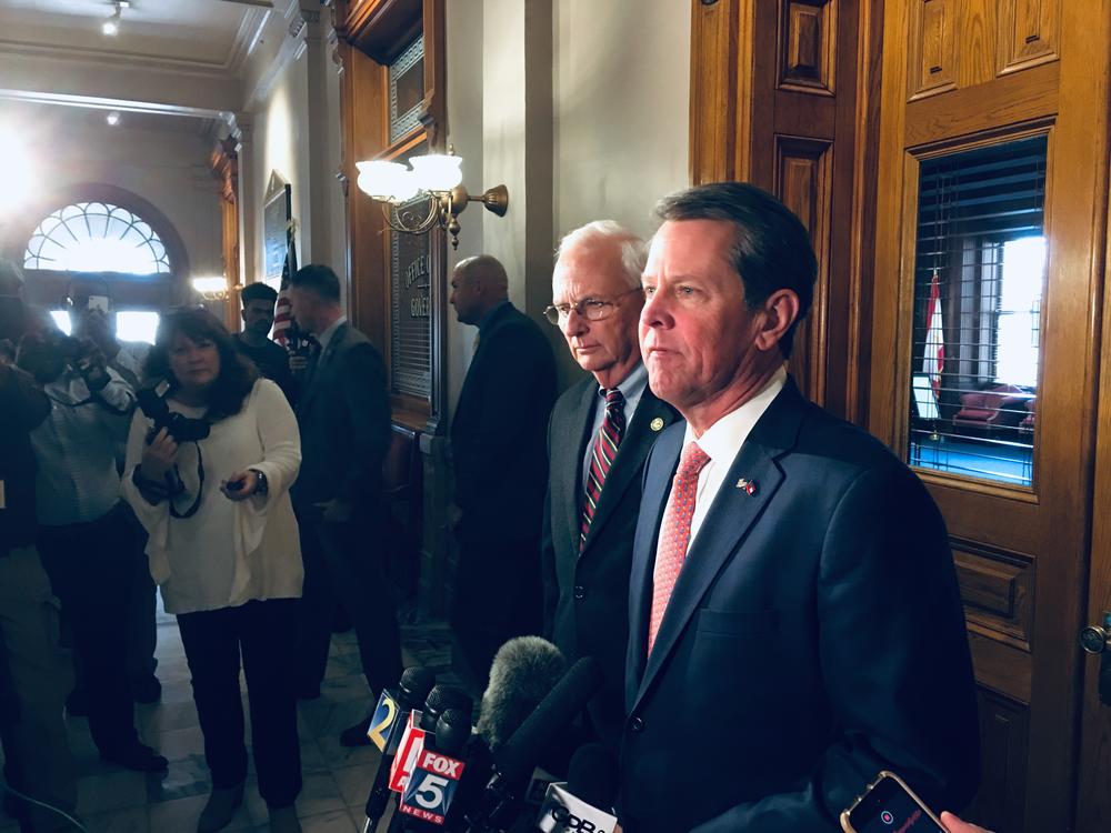 Gov. Brian Kemp and Agriculture Commissioner Gary Black speak to reporters Feb. 27.