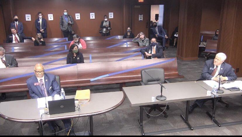 Legislators social distance at a hearing on hate crime legislation in the state House.