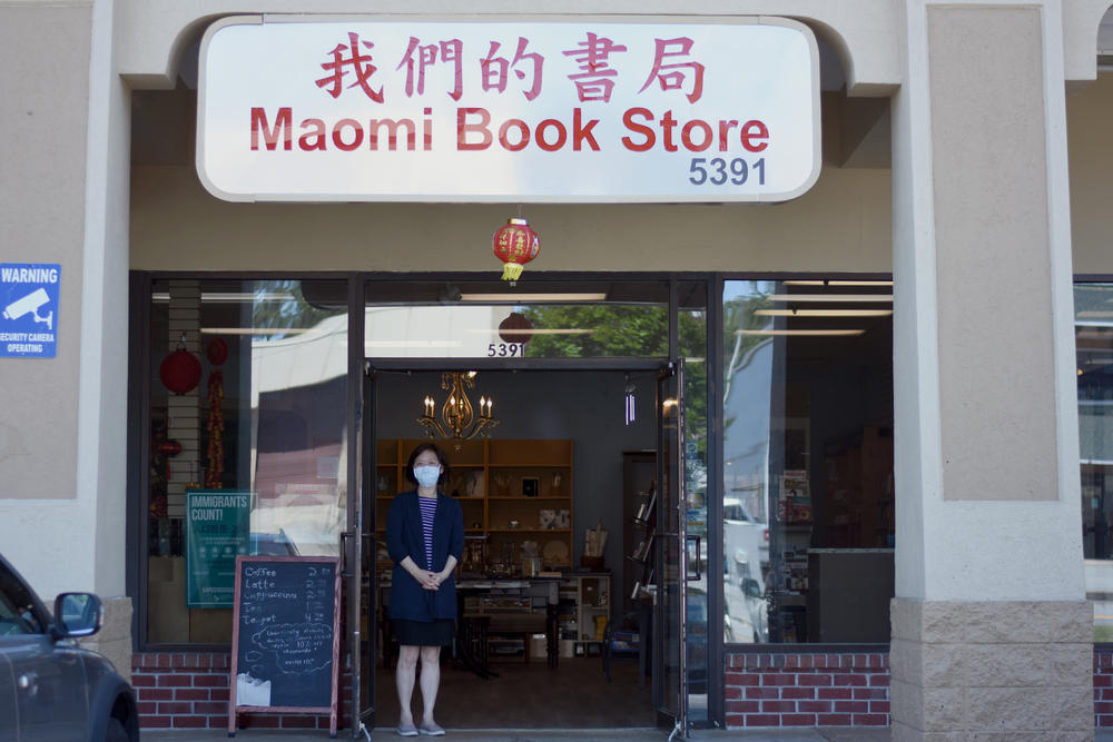 Maomi Bookstore owner Yvonne Hou stands in front of her reopened shop in the Chinatown Mall in Chamblee. Maomi also sells tea, holds events and serves as a hub for the surrounding community.