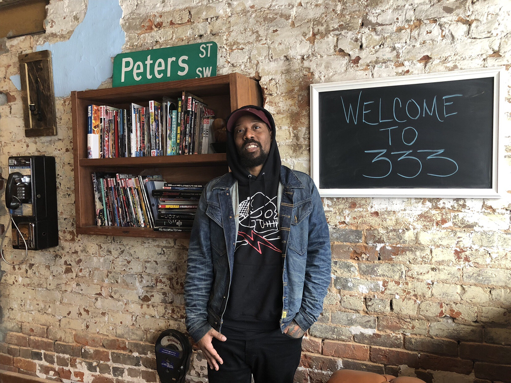 Artist Miya Bailey poses inside Peters Street Station Community Center in Castleberry Hill