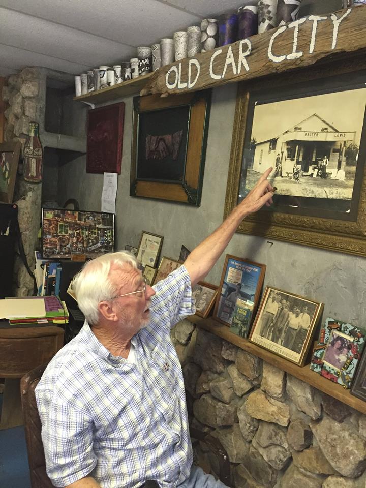 Dean Lewis is the owner of Old Car City USA. Old Car City started as a Car Dealership in 1931 under his parent's leadership. Lewis points to a picture of his parents.