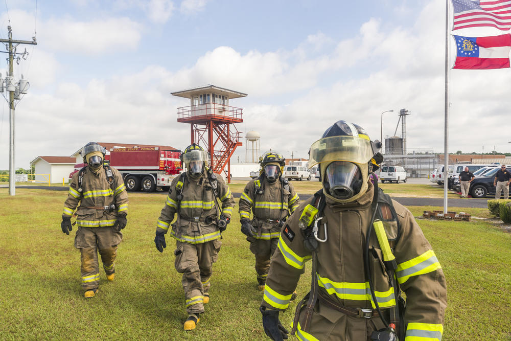 Firefighters from the Dodge State Prison fire department during a recent training demonstration. The fire department regularly aids local volunteer departments and even spent weeks fighting wildfires around the Okefenokee Swamp.