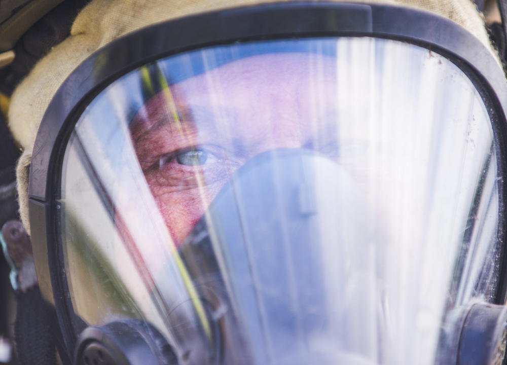 Firefighter David Foxworth in his respirator during a training demonstration. 