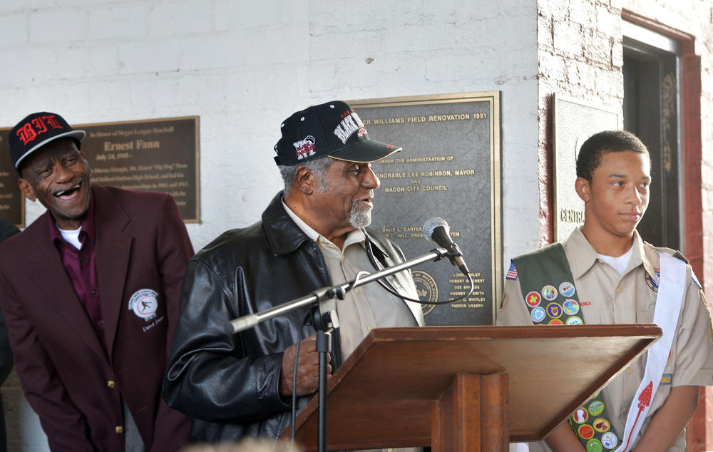 Eagle  scout candidate Gordon Smith, right, is congratulated by two of the Negro League baseball players, Ernest Fann, left, and Robert Scott, center, he helped honor with plaques at Luther Williams Field Saturday in Macon, Ga. 
