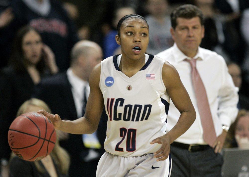 In this March 31, 2009, file photo, Connecticut guard Renee Montgomery brings the ball up during the second half of a women's NCAA college basketball tournament regional final against Arizona State in Trenton, N.J. 