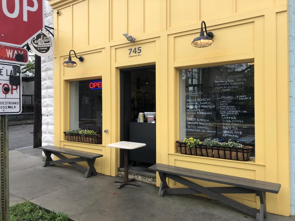 Businesses in Atlanta, as well as across Georgia and much of the United States, are trying to adapt to the public health crisis. A donut shop near Inman Park keeps customers at the front door, and offers hand sanitizer with their selection of pastry.