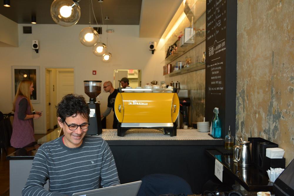 Octavian Stan getting some work done over coffee.