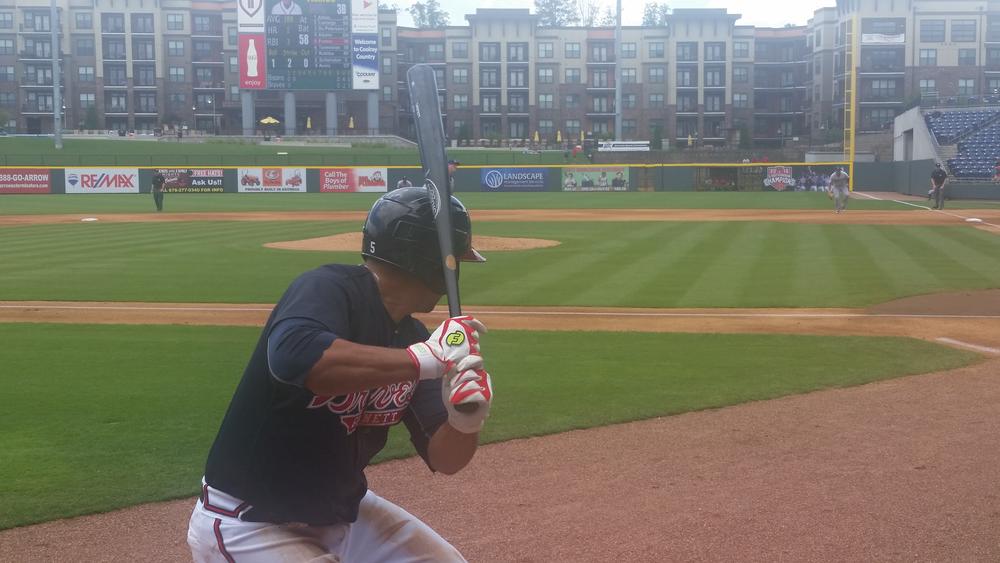 Matt Tuiasosopo warms up before his plate appearance against the Buffalo Bisons