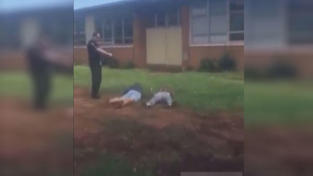 Amateur video of a police officer using his taser in 2015 to break up a fight between two students at Rockdale County High School in Conyers, Georgia.