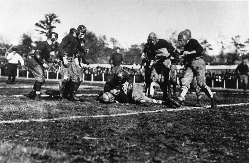 Georgia Tech's players tackle a Cumberland running back during the 1916 game.