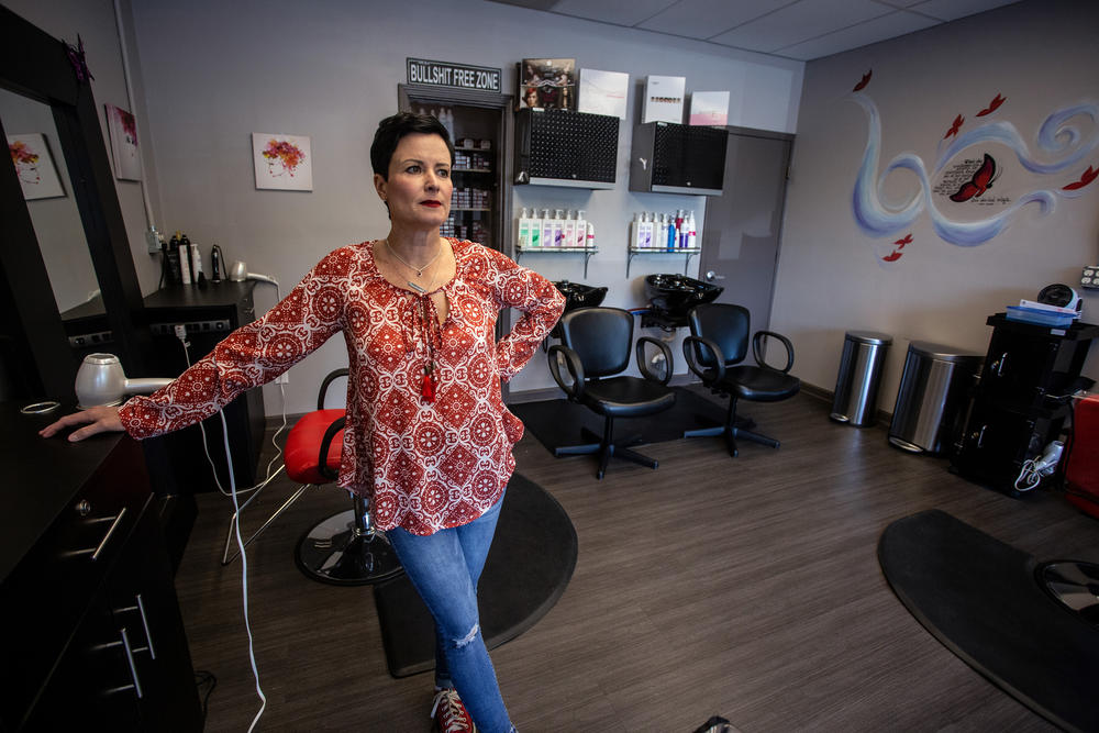Naomi Bartolacci stands at her hair stylist station at Like Butterflies Salon on Tuesday, April 21, 2020, in Avondale Estates, Ga. Bartolacci and her co-workers voluntarily closed the salon as COVID-19 spread, but they are discussing how soon to reopen.