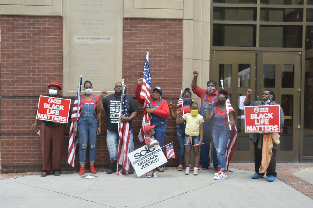 Supporters stand outside of Ebenezer Baptist Church on Tuesday.