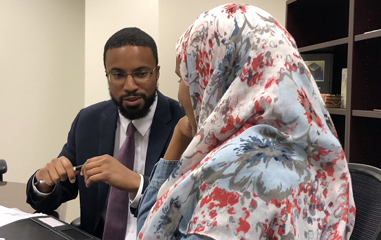 Attorney Edward Ahmed Mitchell (left) discusses on July 24 what Aisha Hussain saw when she and family members watched the April 28 police dashcam footage of her younger sister's shooting.