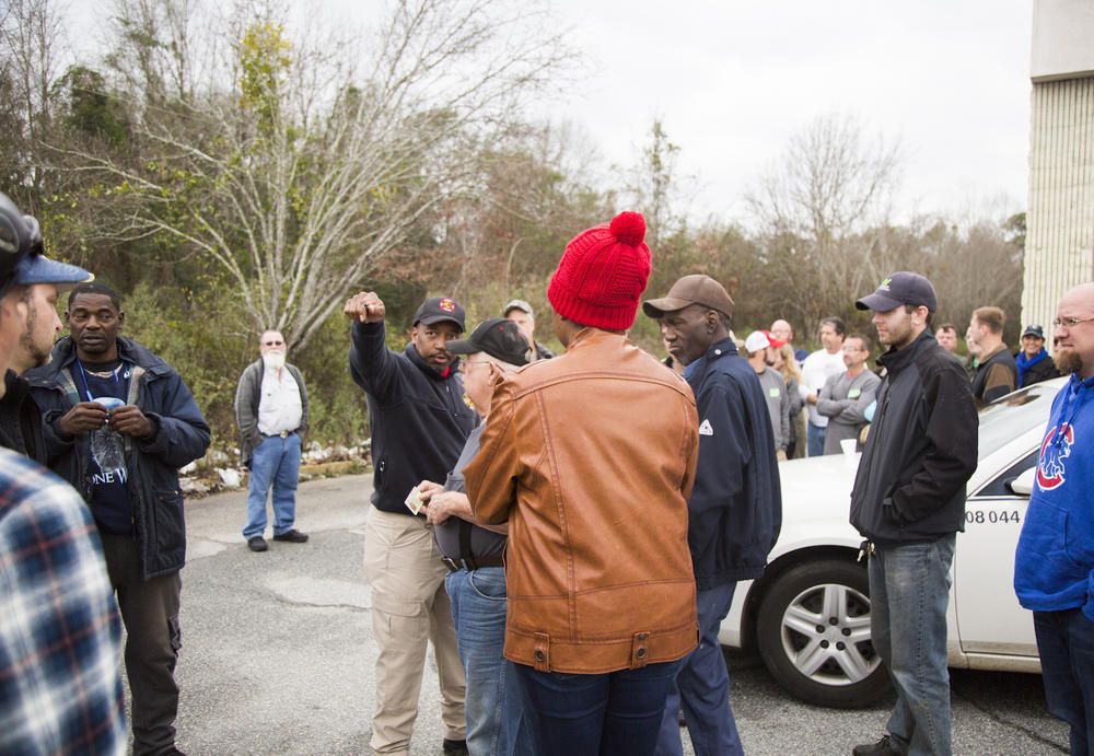 A single firefighter was left to register eager volunteers before police would let them past a roadblock into one of the most storm damaged parts of Albany. The wait just to sign up was upwards of 45 minutes. 